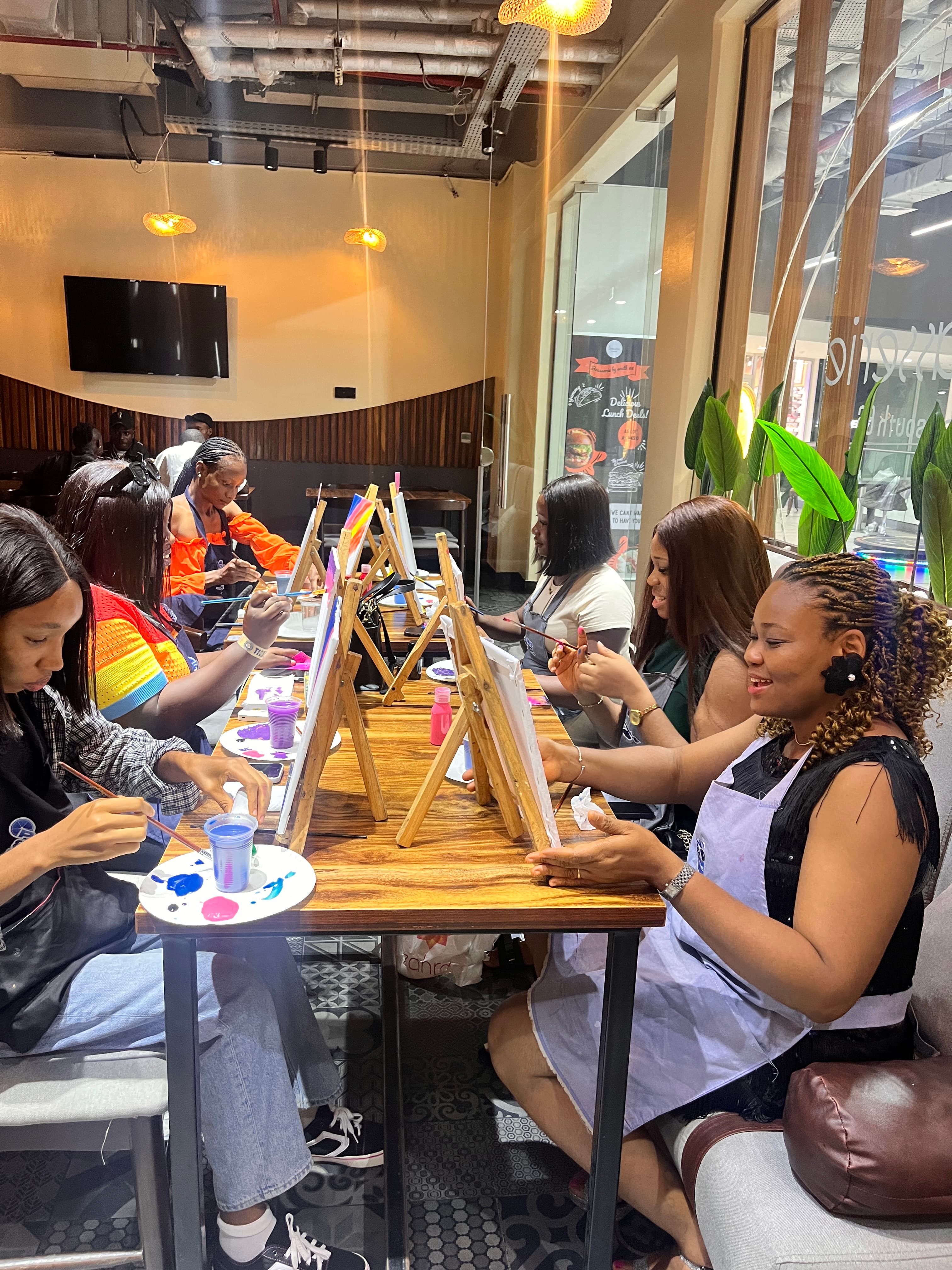 People painting, making candles and potteries